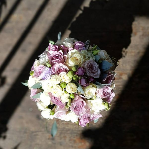 image of a compact bridal bouquet with pink and white roses by Adonis