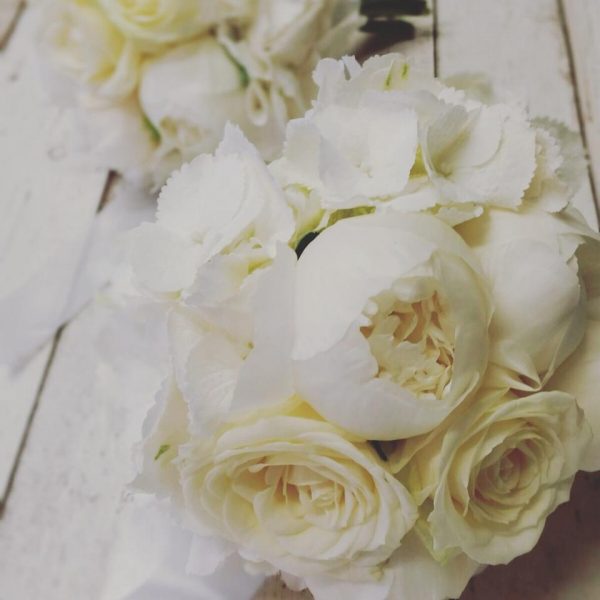 Image of a white peony and hydrangea bridal bouquet by Adonis