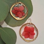 image of round earrings featuring red viola by Irish supplier Prickle and plum