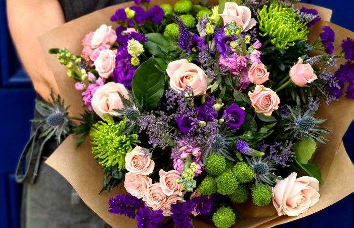 Image of the cashel bouquet by Adonis, featuring a selection of purples, greens and pinks