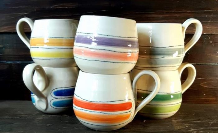 Image of 6 assorted colourful, handcrafted mugs by Irish supplier TomPow Pottery